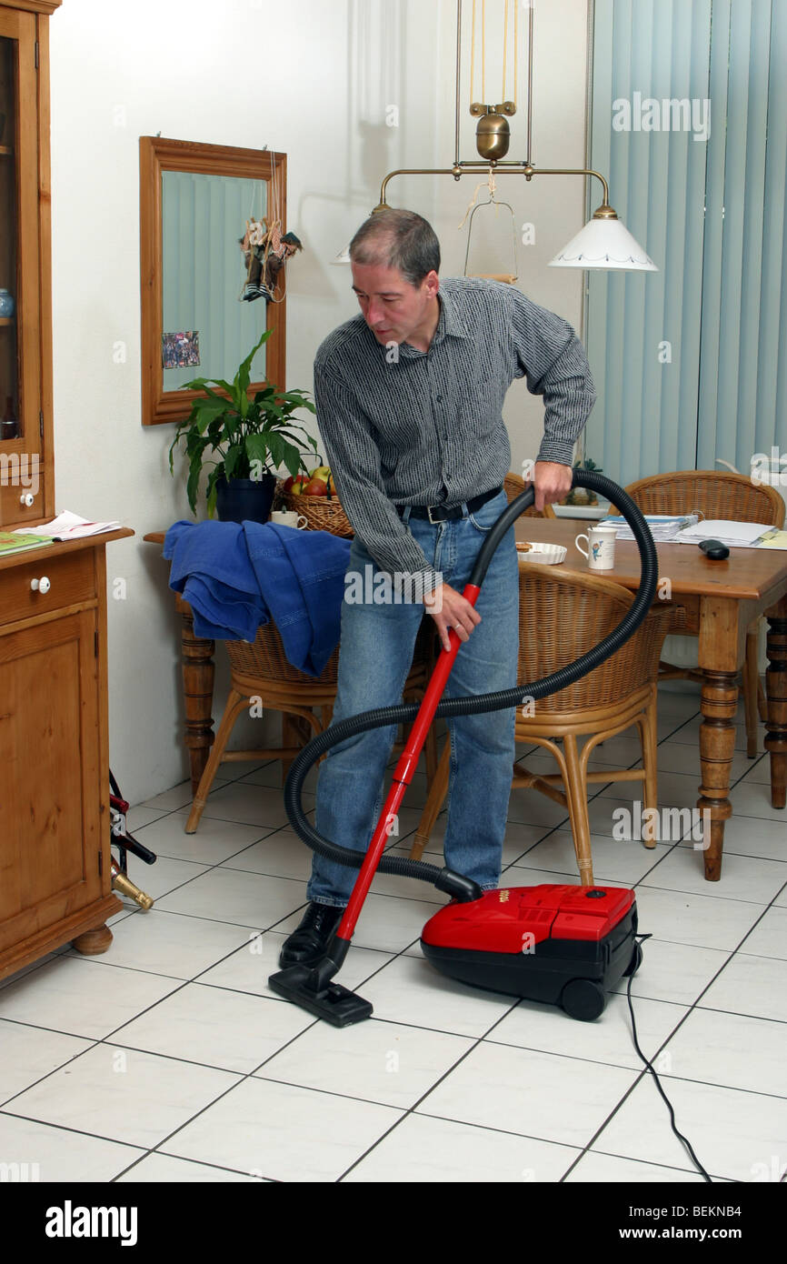 Houseman housekeeping cleaning vacuum cleaner Stock Photo, Royalty Free