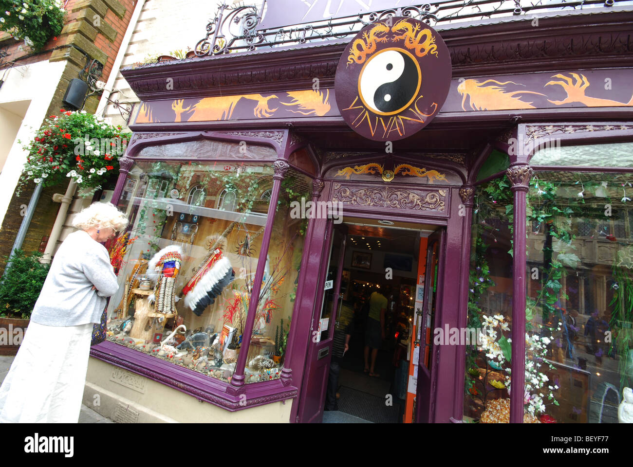 Colourful shop front in Glastonbury High Street Somerset England Stock