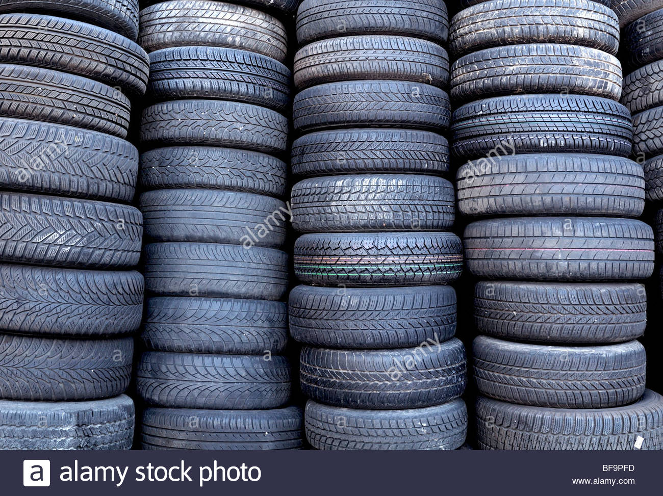 DEU, GERMANY Old tyres / tires on a scrapyard / junkyard Stock Photo