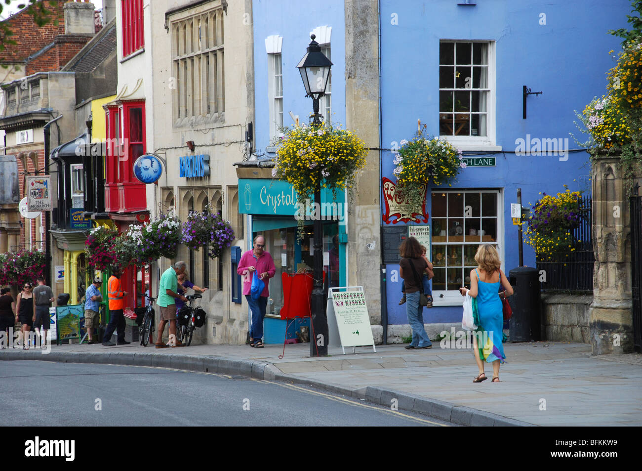 Colourful shops in Glastonbury High Street Somerset England Stock Photo
