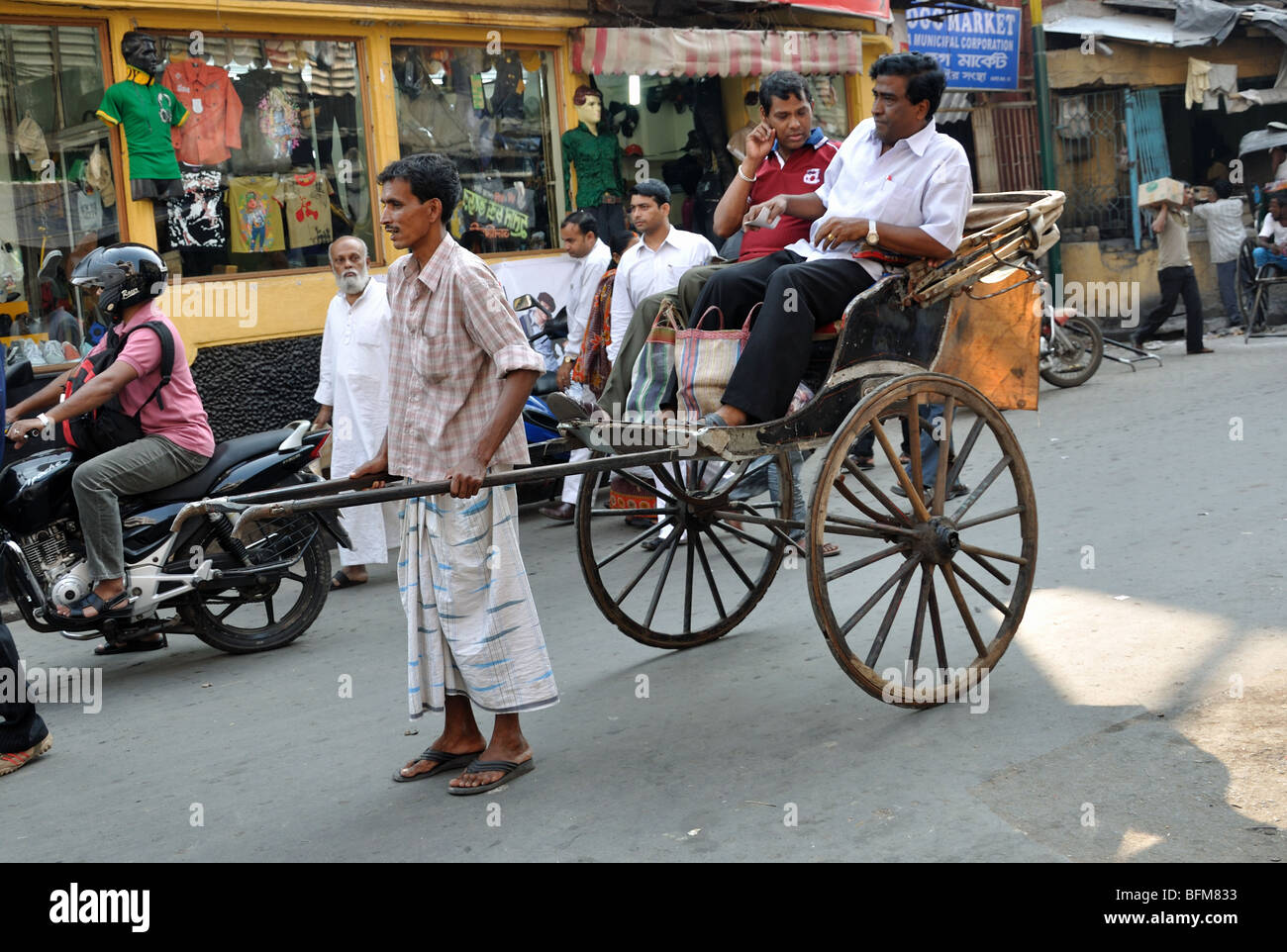 Hand pulled rickshaws waiting for customers at New Market Kolkata Stock