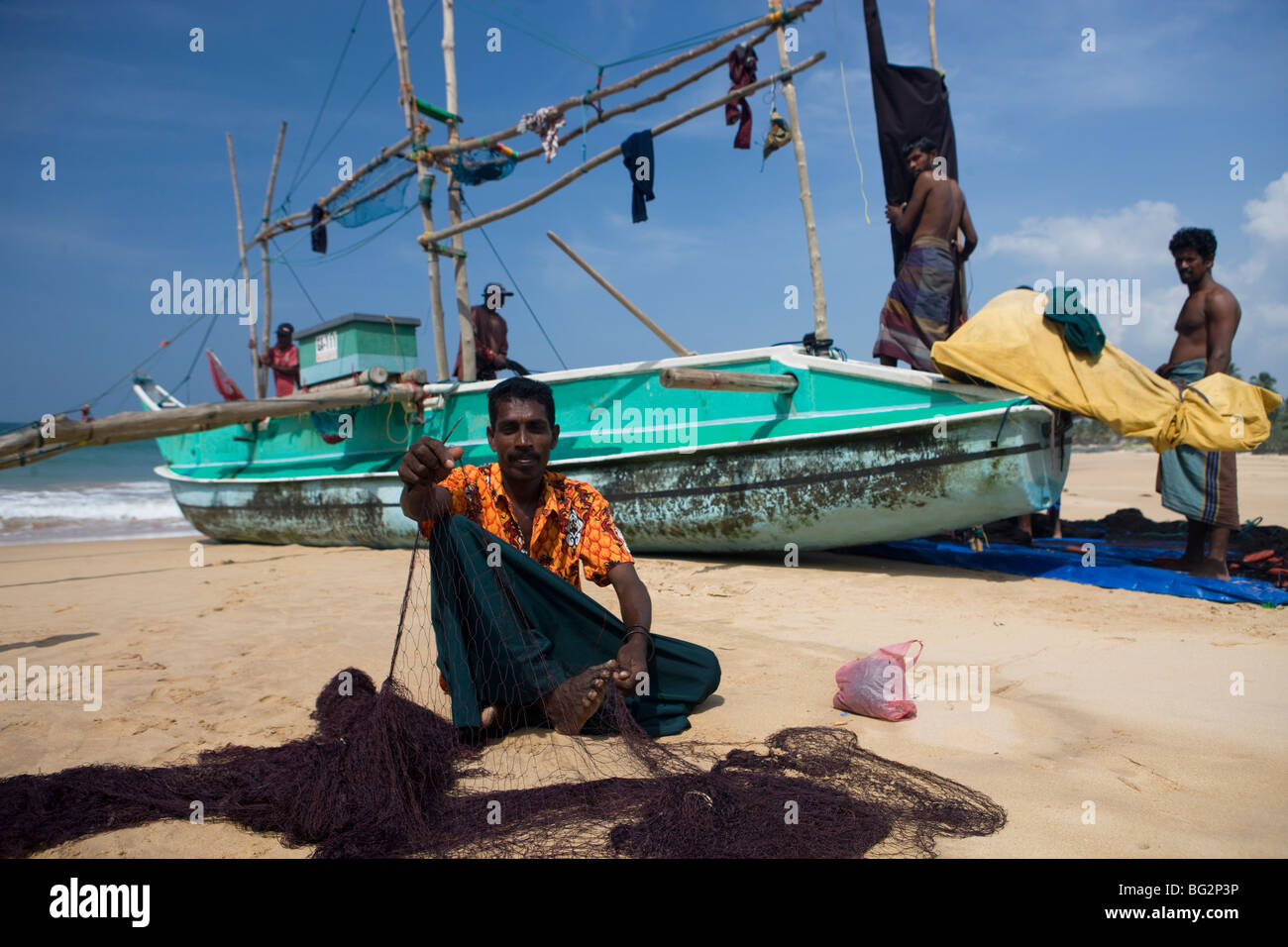 Fisherman Repairing His Nets Hi Res Stock Photography And Images Alamy