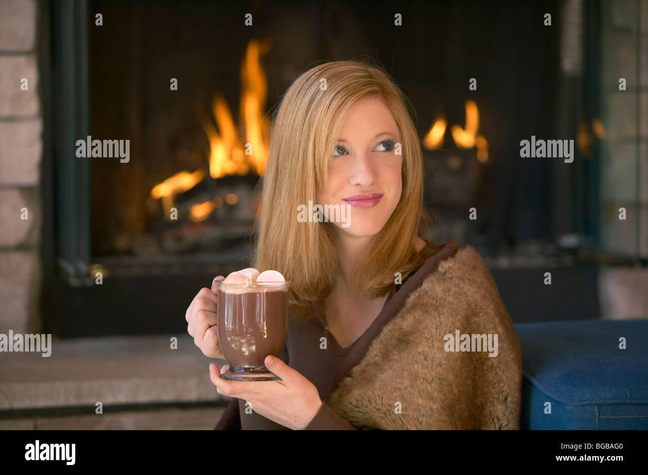 girl-drinking-hot-chocolate-near-fire-BG