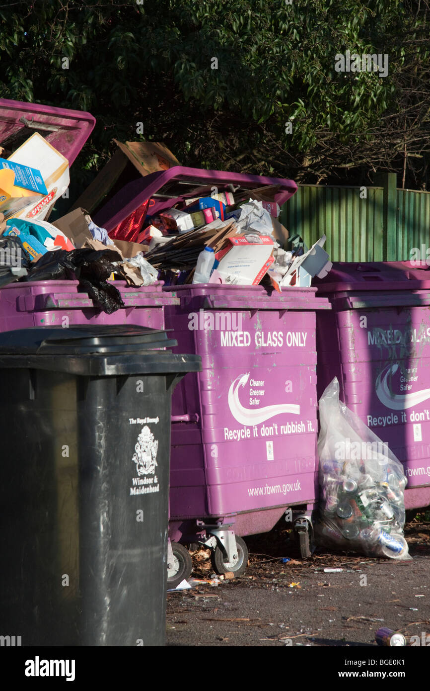 Overflowing recycling bins filled with the wrong rubbish. Bins Stock