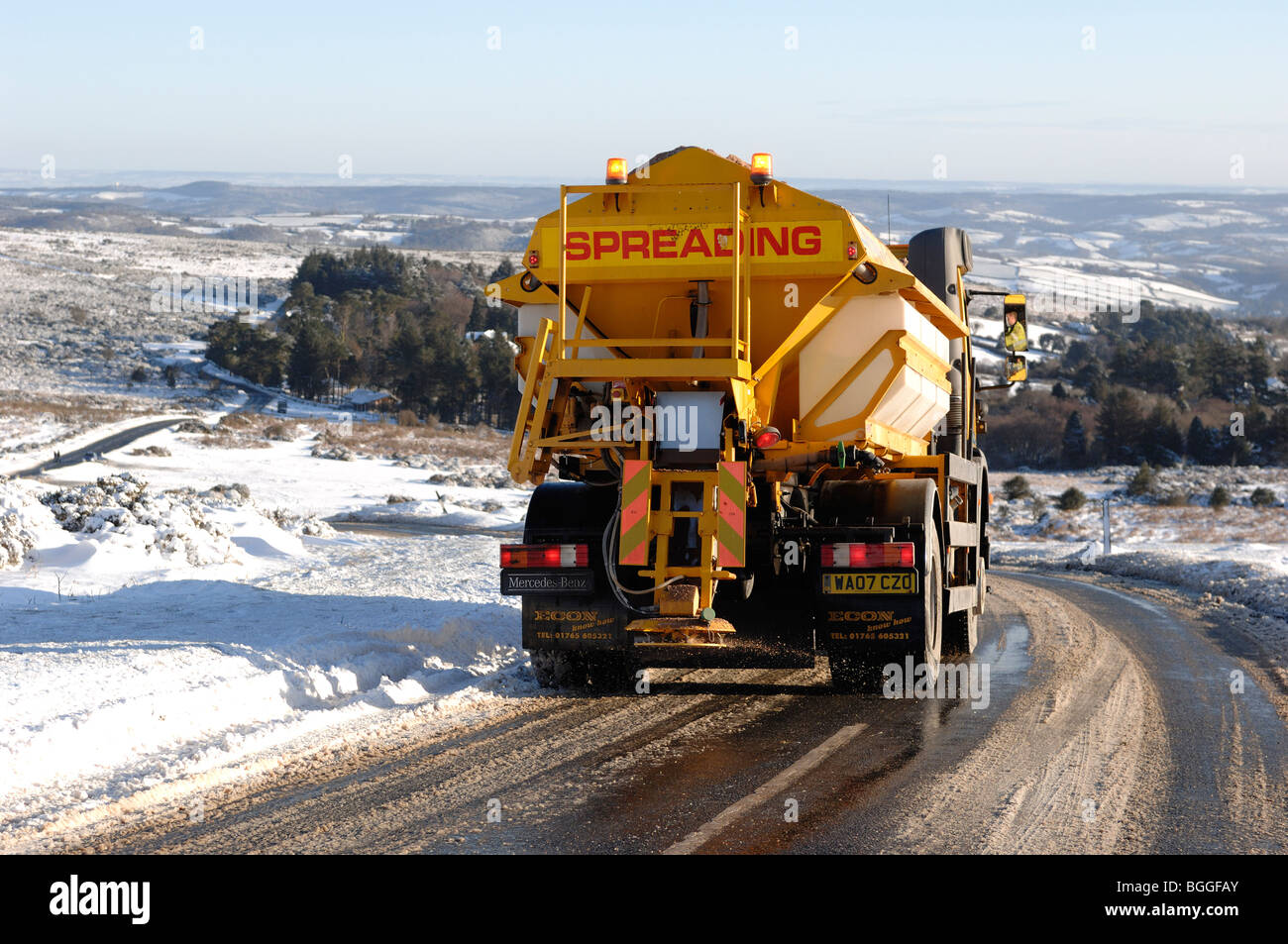 Gritting lorry spreading grit on Dartmoor Devon at Haytor Stock Photo
