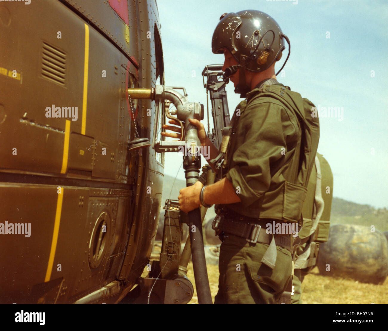 Crew chief 1st Cavalry Division Airmobile, refuels his assigned UH1D