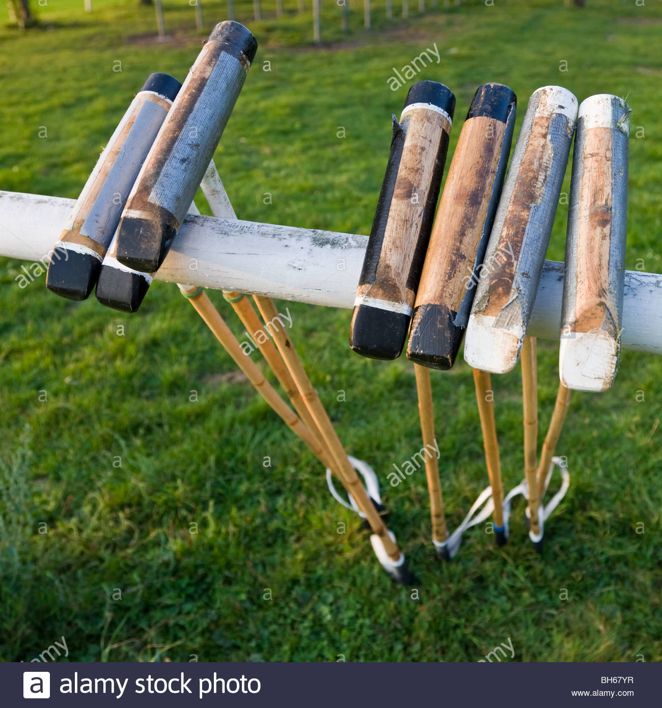 polo mallets sticks leaning upside down banister equestrian sports