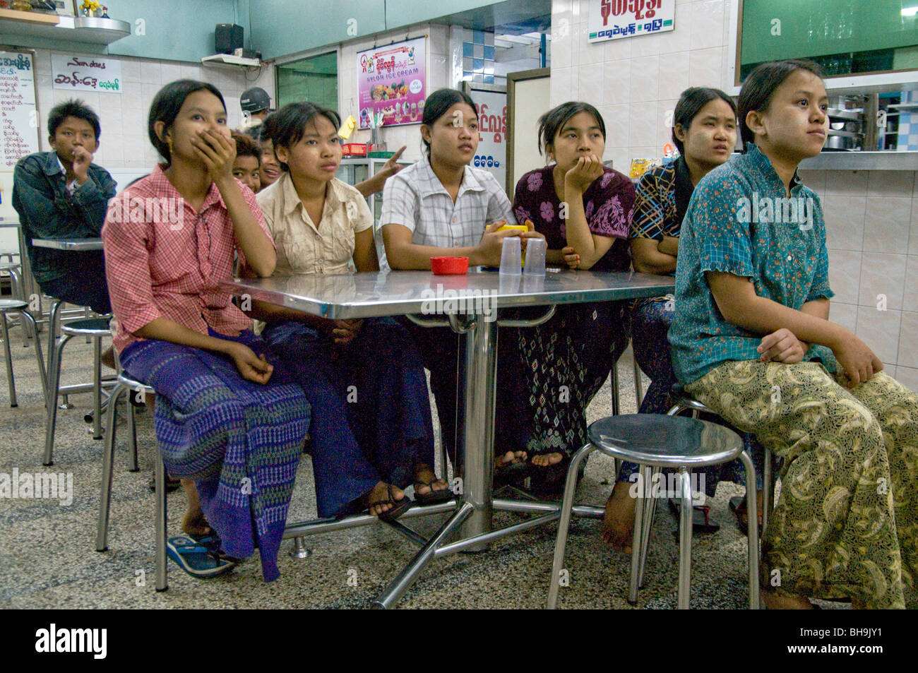 MYANMAR (BURMA) YOUNG WOMEN WATCHING A SOAP OPERA IN A TEA ...