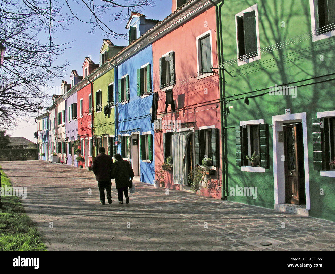 Color houses cottages Burano Island Venice Italy fall couple Color houses cottages Burano Island Venice Italy fall couple