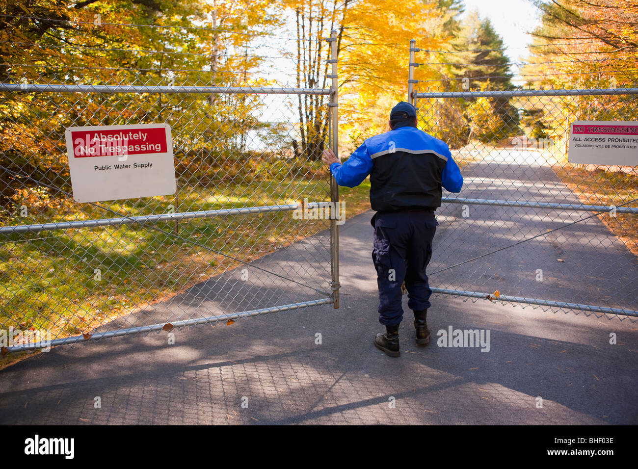 Security guard opening a gate Stock Photo, Royalty Free Image 27988898