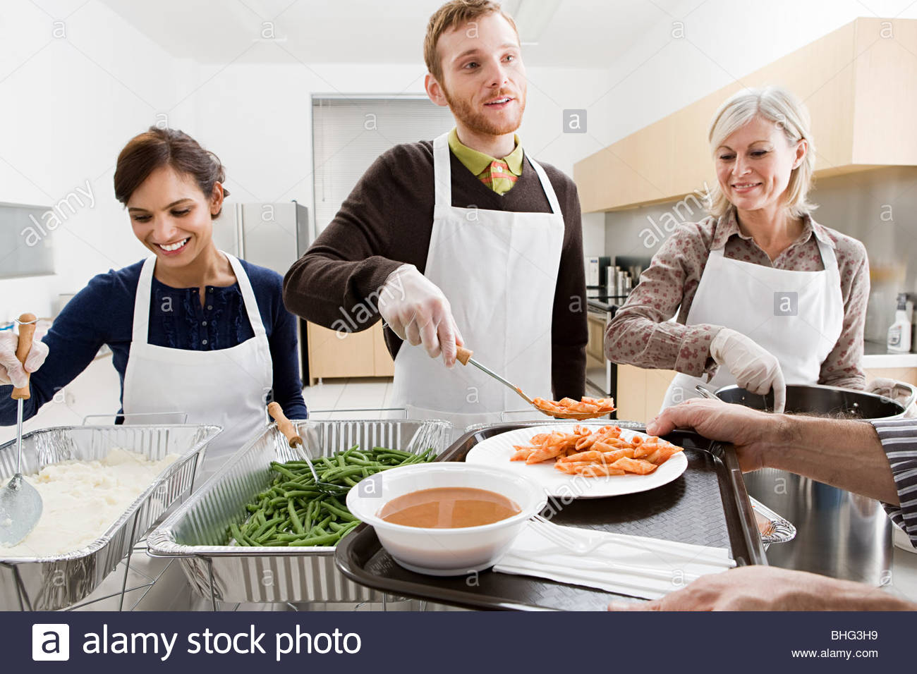 People Volunteering At Soup Kitchen Stock Photo Royalty Free