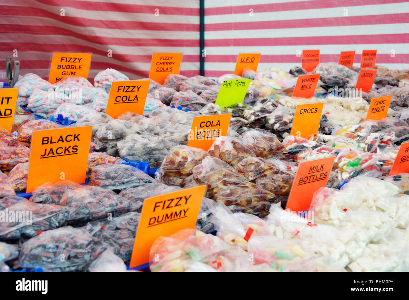 Assorted bags of sweets or candy on an English market stall in south Stock Photo, Royalty Free
