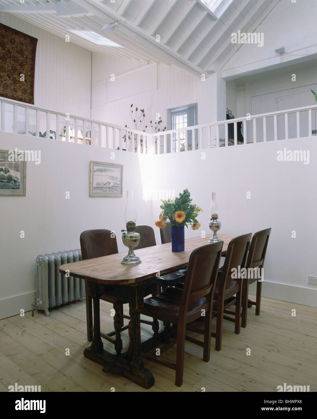 Mezzanine Loft Conversion wood table and chairs in modern loft conversion dining room with Mezzanine Loft Conversion wood table and chairs in modern loft conversion dining room with