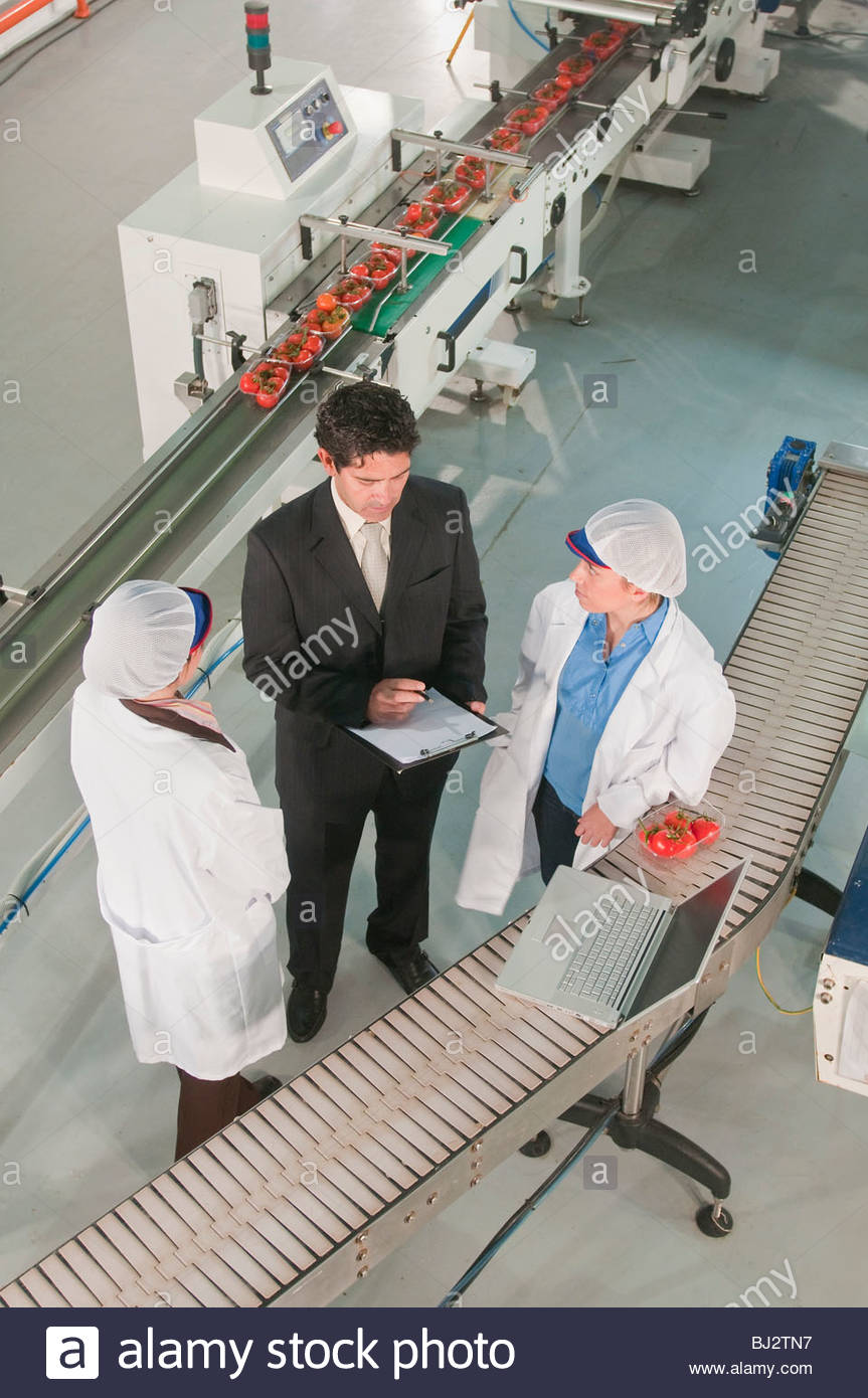 workers in food processing facility Stock Photo, Royalty Free Image