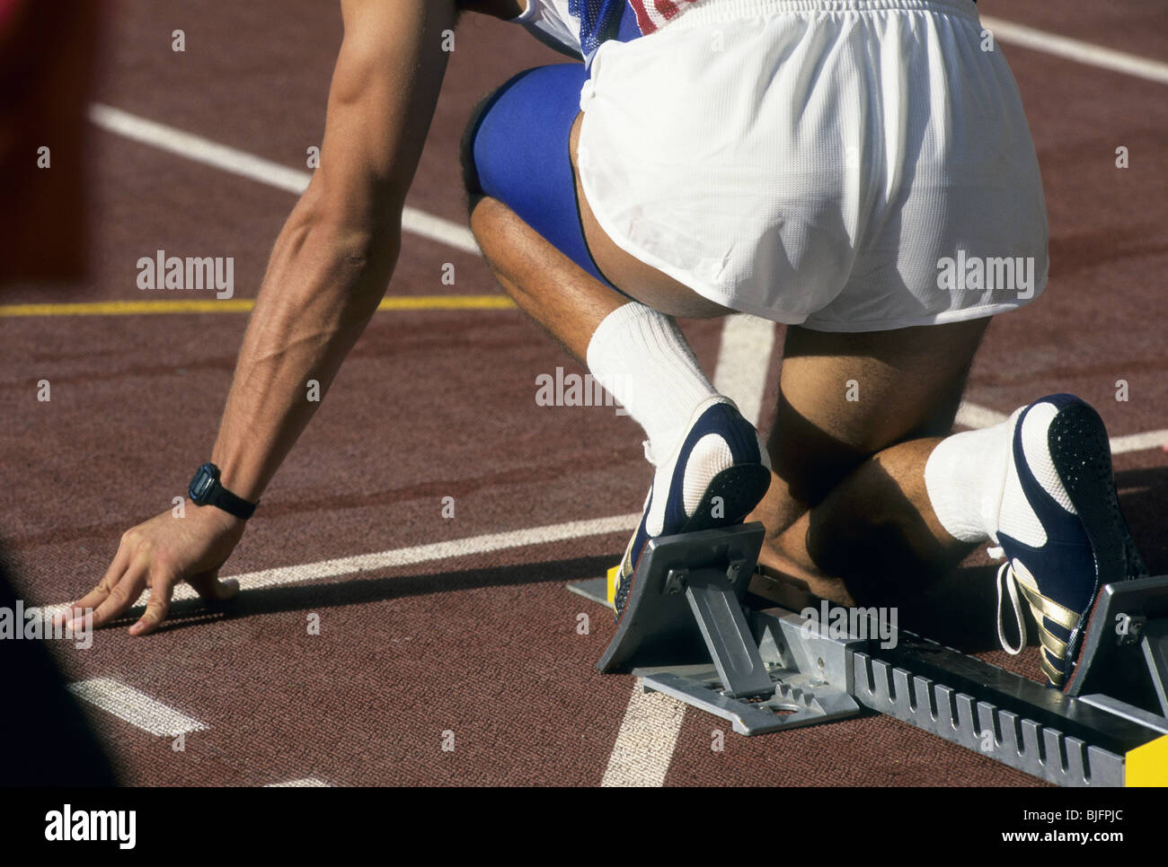 Close up of a sprinter in the starting block Stock Photo, Royalty Free