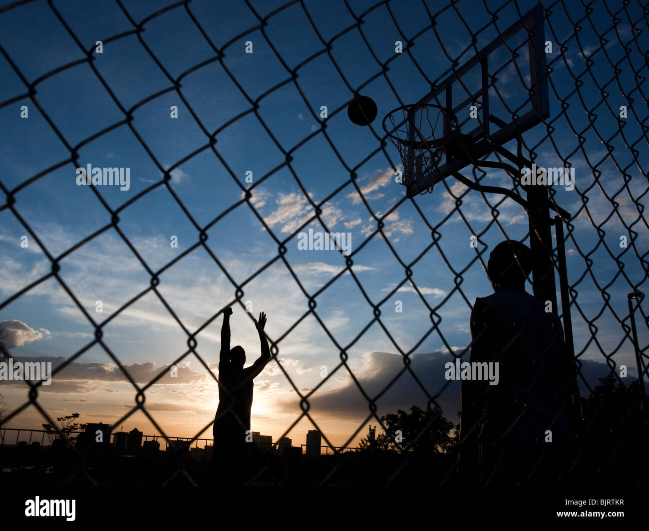 USA, Utah, Salt Lake City, two young men playing street basketball