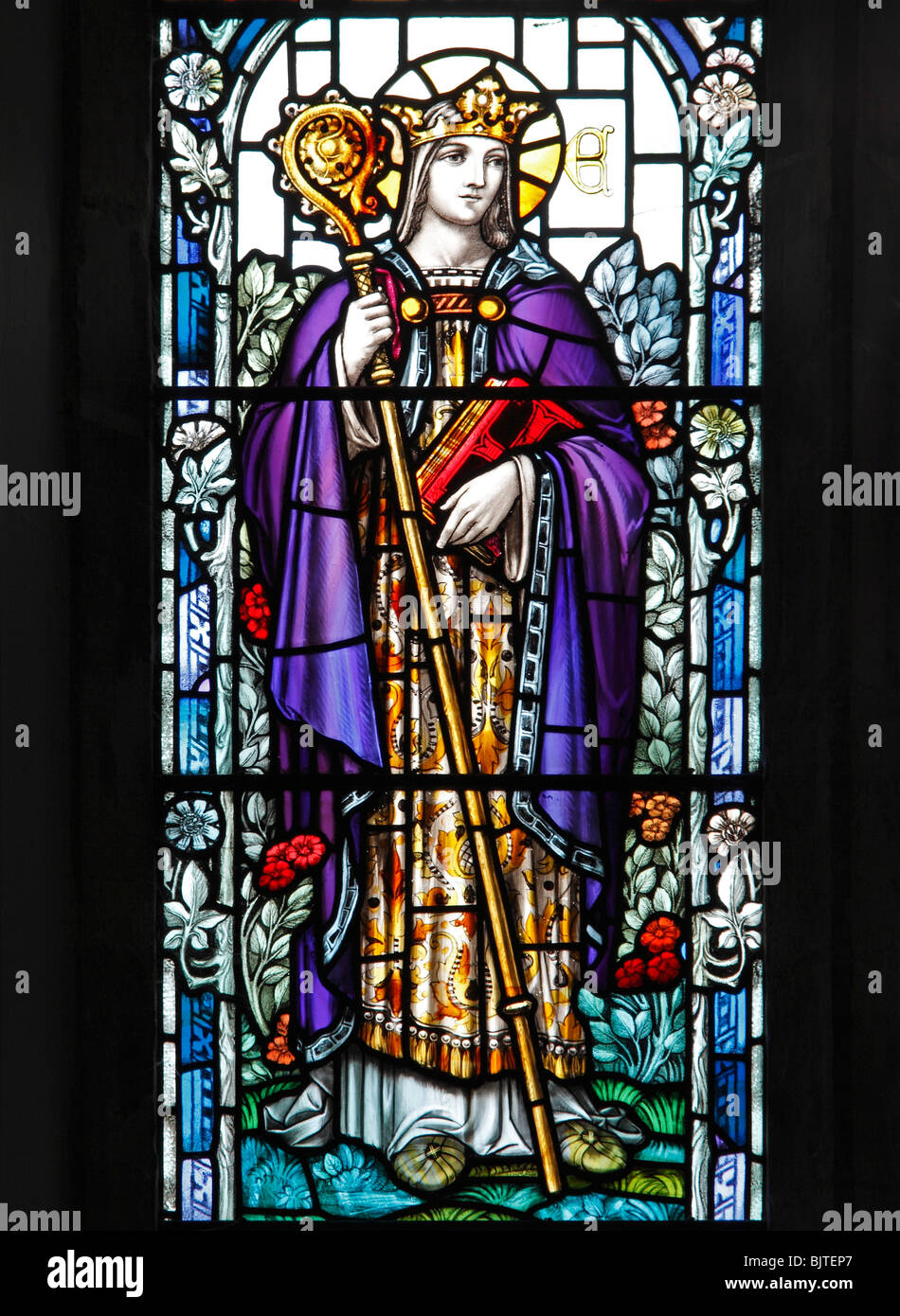 A stained glass window depicting Saint Etheldreda AKA Audrey, founder