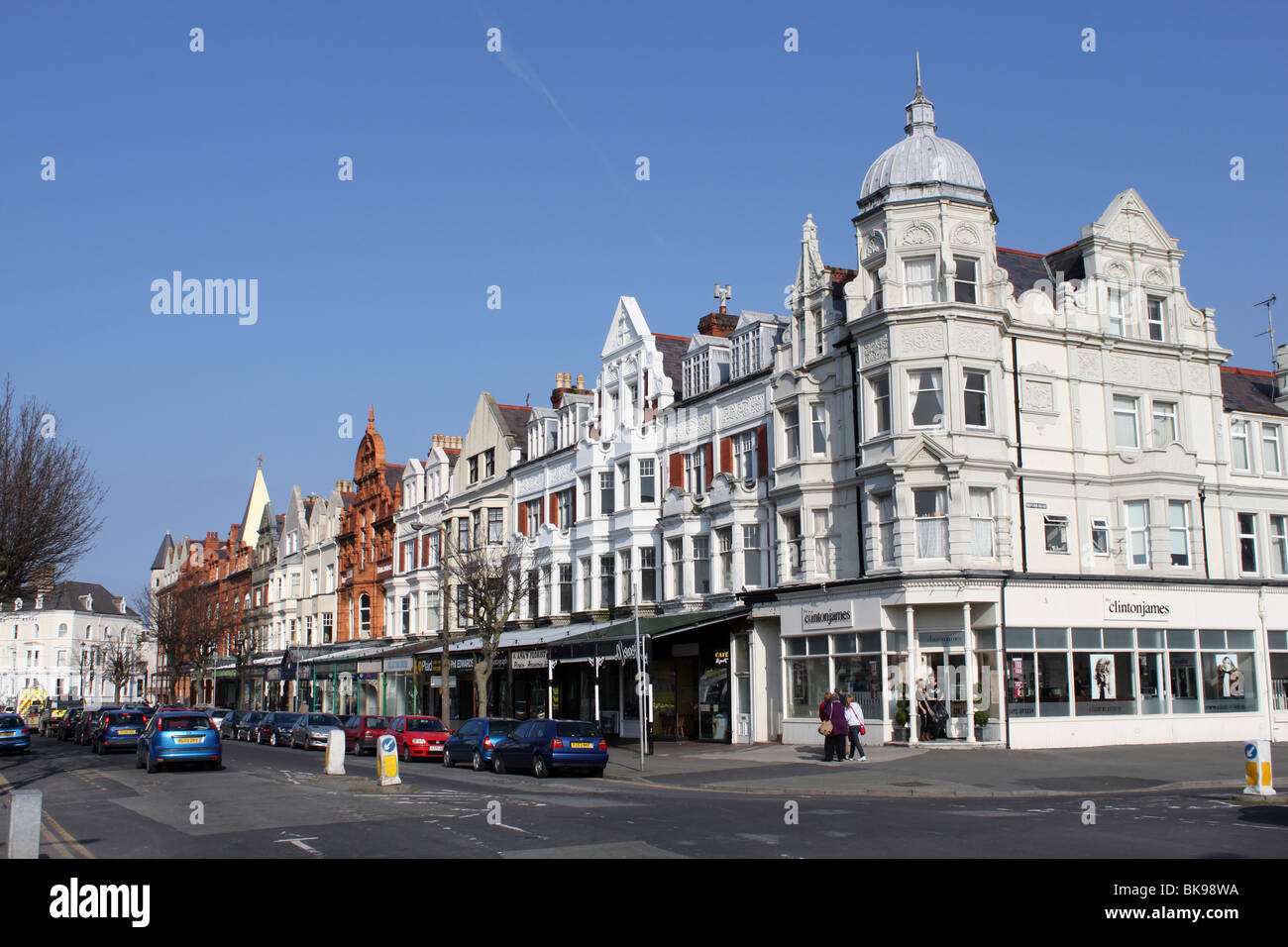 View along a row of shops and buildings on Vaughan Street, Llandudno Stock Photo, Royalty Free