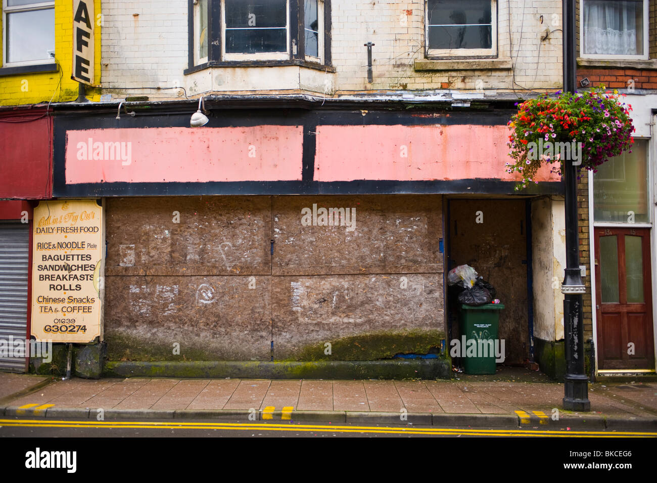 boarded up shops Closed and boarded up shop in Neath South Wales UK