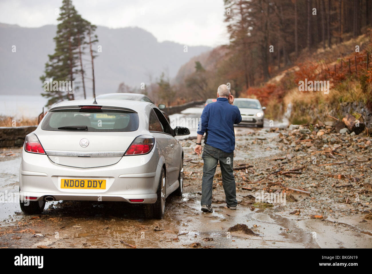 The A591 road at Thirlmere blocked by flood debris during the Stock Photo, Royalty Free Image