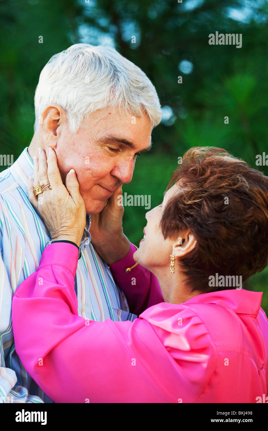 Nude girl in party Woman holding a mans face in her hands