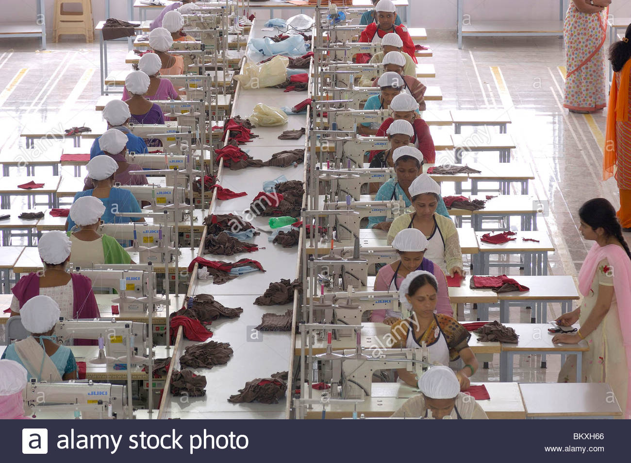 Readymade garment factory Interior people working on sewing machine