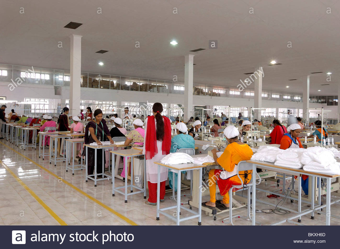 Readymade garment factory Interior people working on sewing machine
