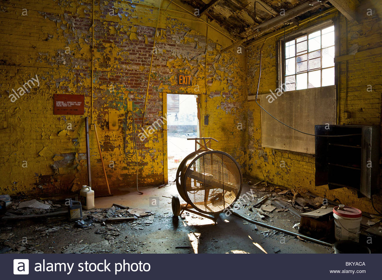 Abandoned warehouse with peeling yellow paint on the walls. Atlanta Stock Photo, Royalty Free