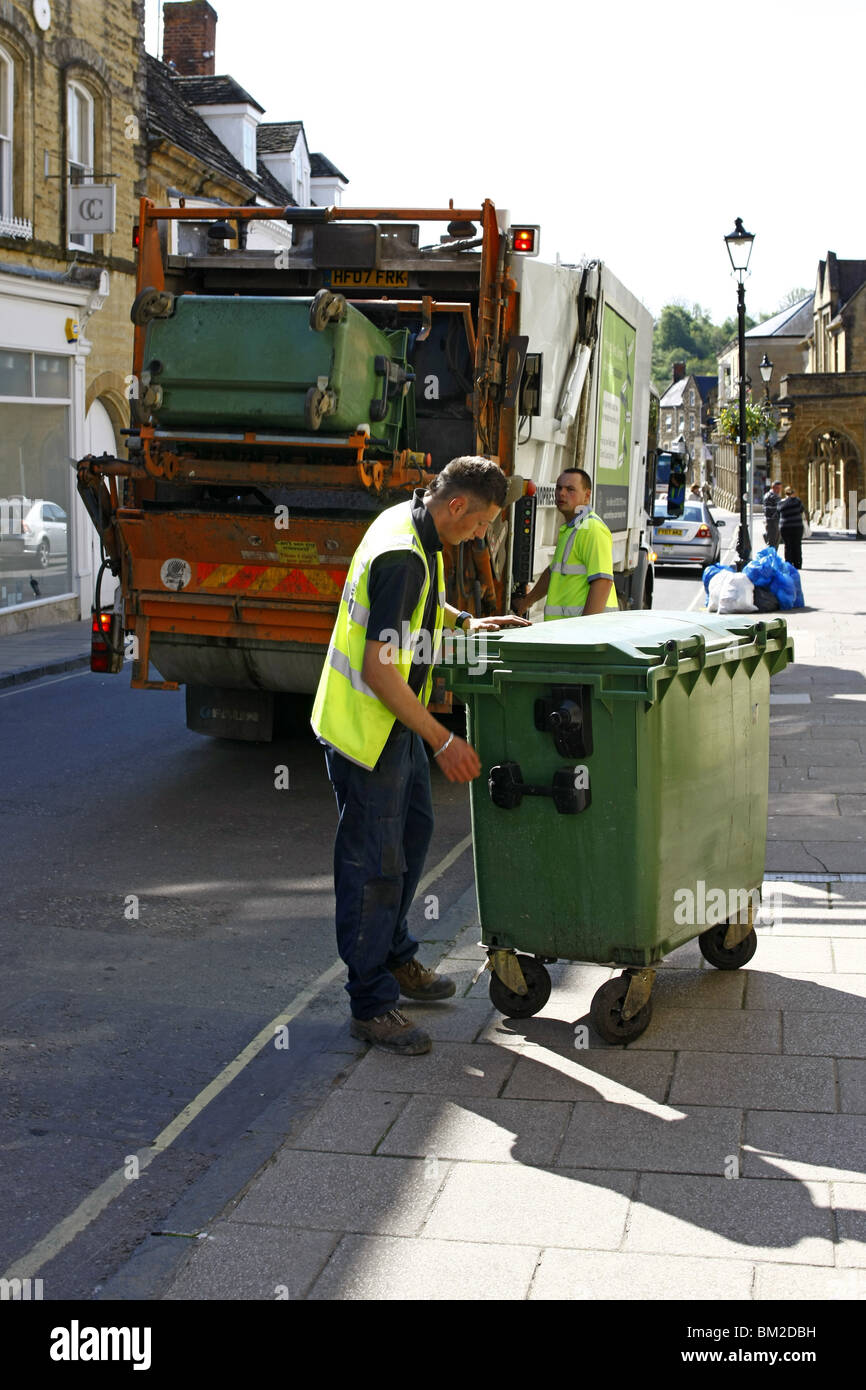 Dustbin men at work on Rubbish collection day in an English town Stock