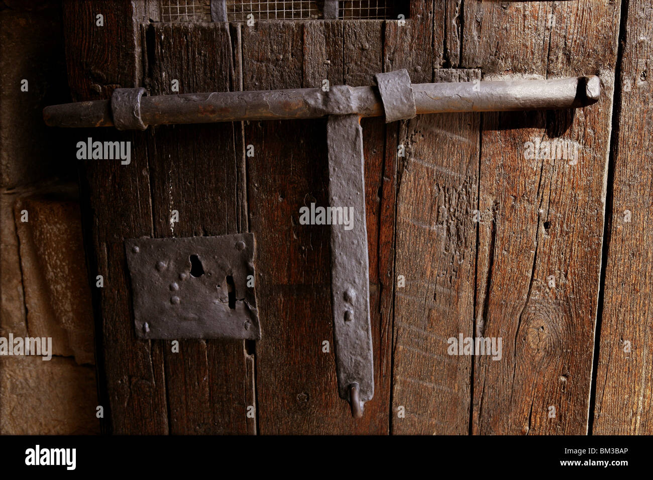 Old medieval lock on wooden castle door, real antique in Spain ... Old medieval lock on wooden castle door, real antique in Spain ...