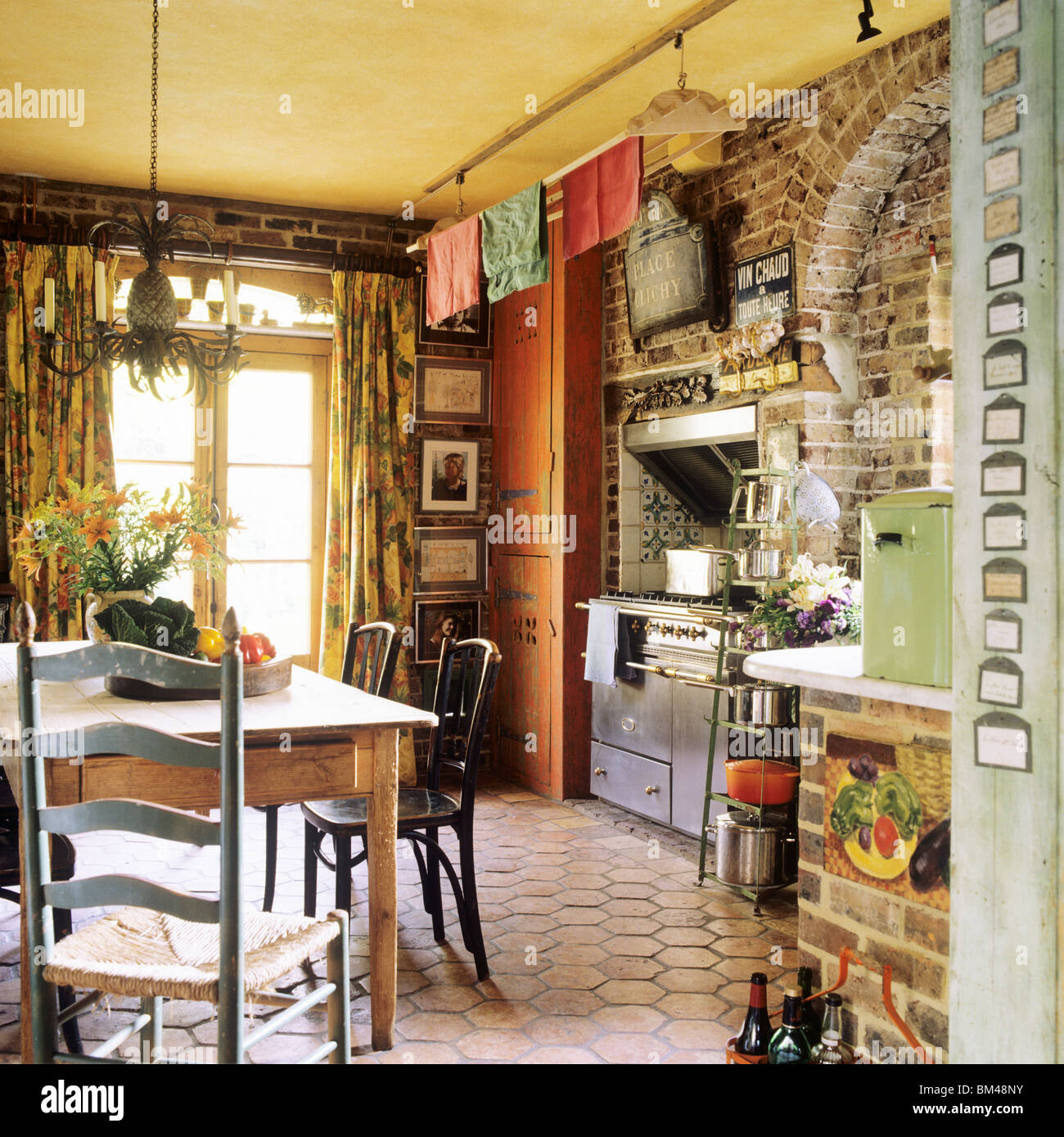 country-kitchen-with-hexagonal-floor-tiles-and-exposed-brick-in-converted-BM48NY.jpg