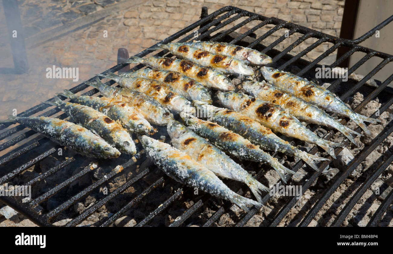 Portugal, The Algarve, Sardines On A Grill Stock Photo, Royalty Free