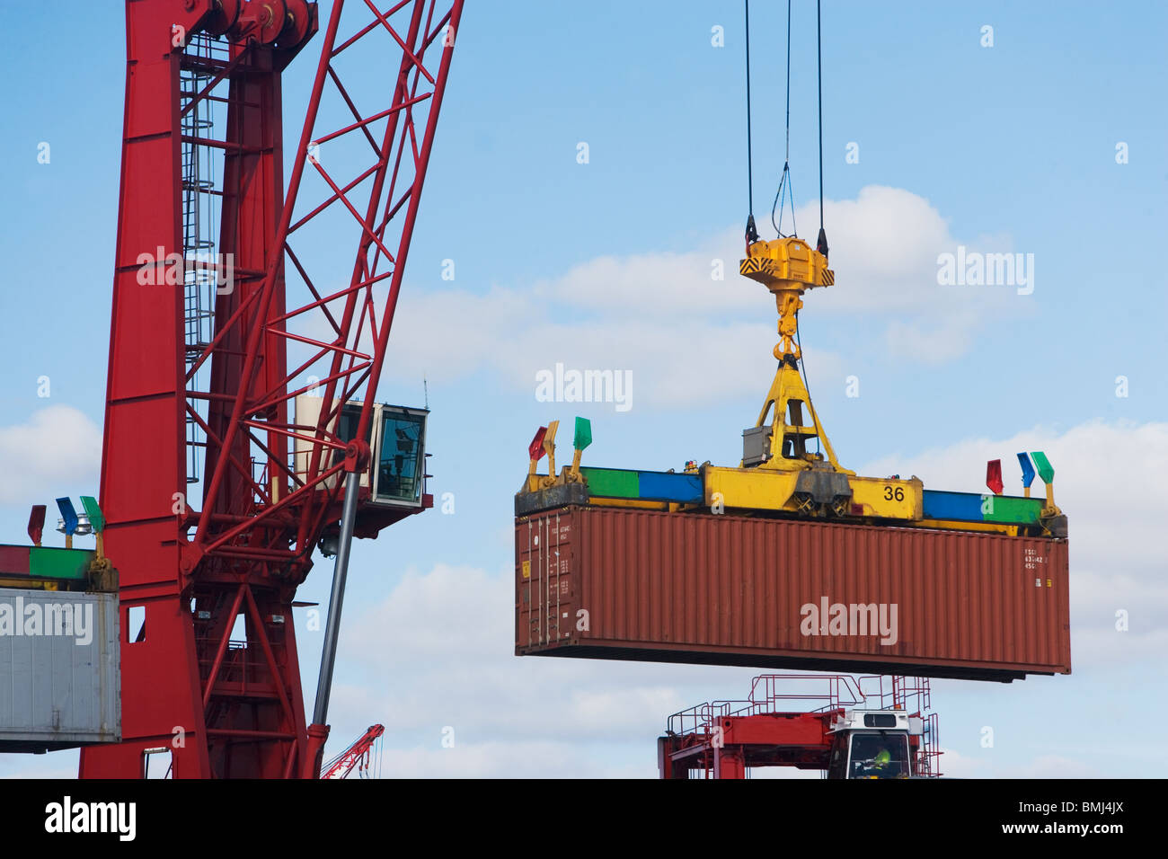 Crane lifting shipping container Stock Photo, Royalty Free Image