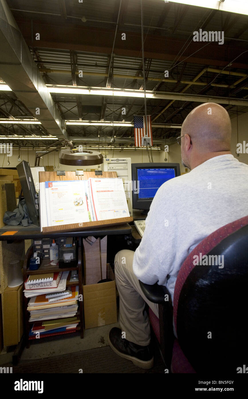Inmate working in the Braille shop at the Nebraska State Stock Photo