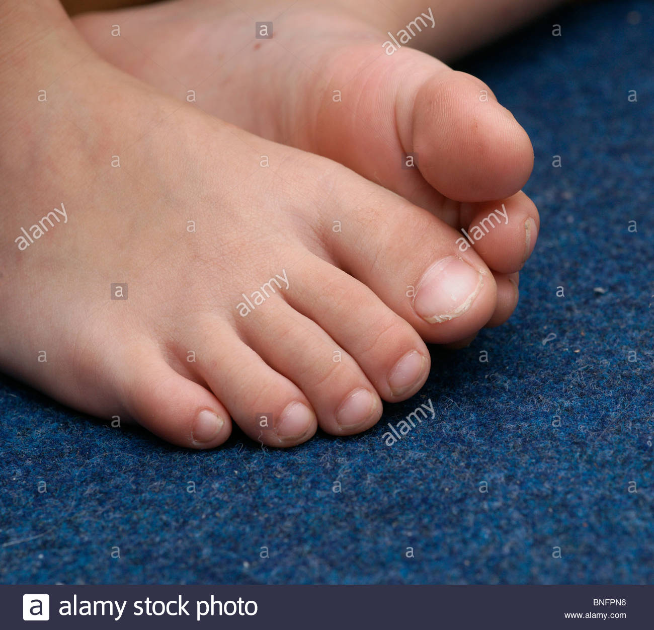 Feet and toes of a sleeping child little boy asleep Stock Photo