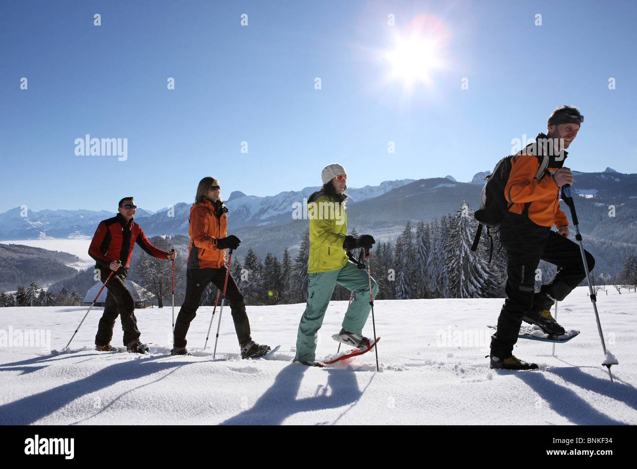 Switzerland winter sports snowshoe snowshoeing running Gibelegg Stock