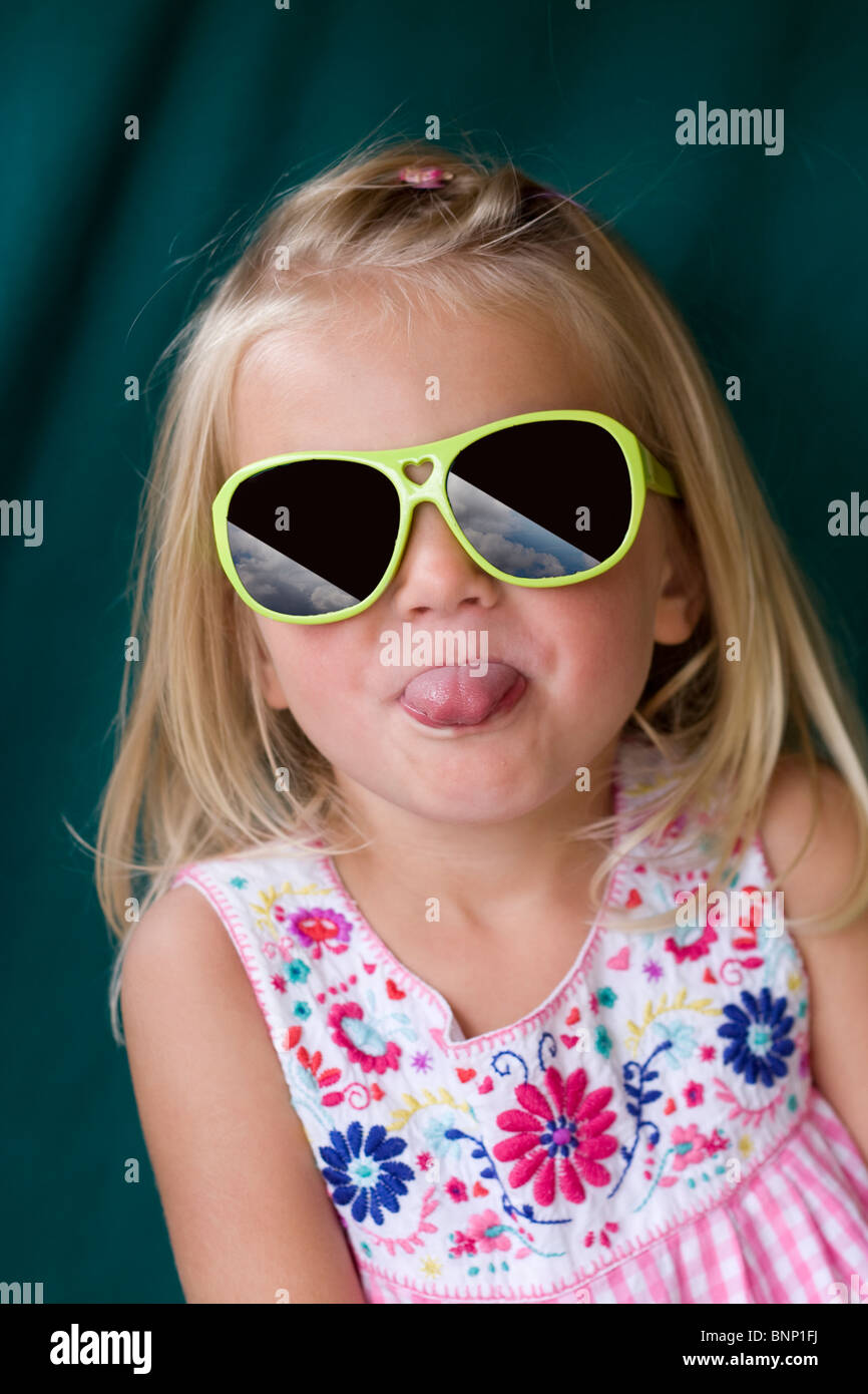 Young girl poking her tongue out Stock Photo, Royalty Free Image