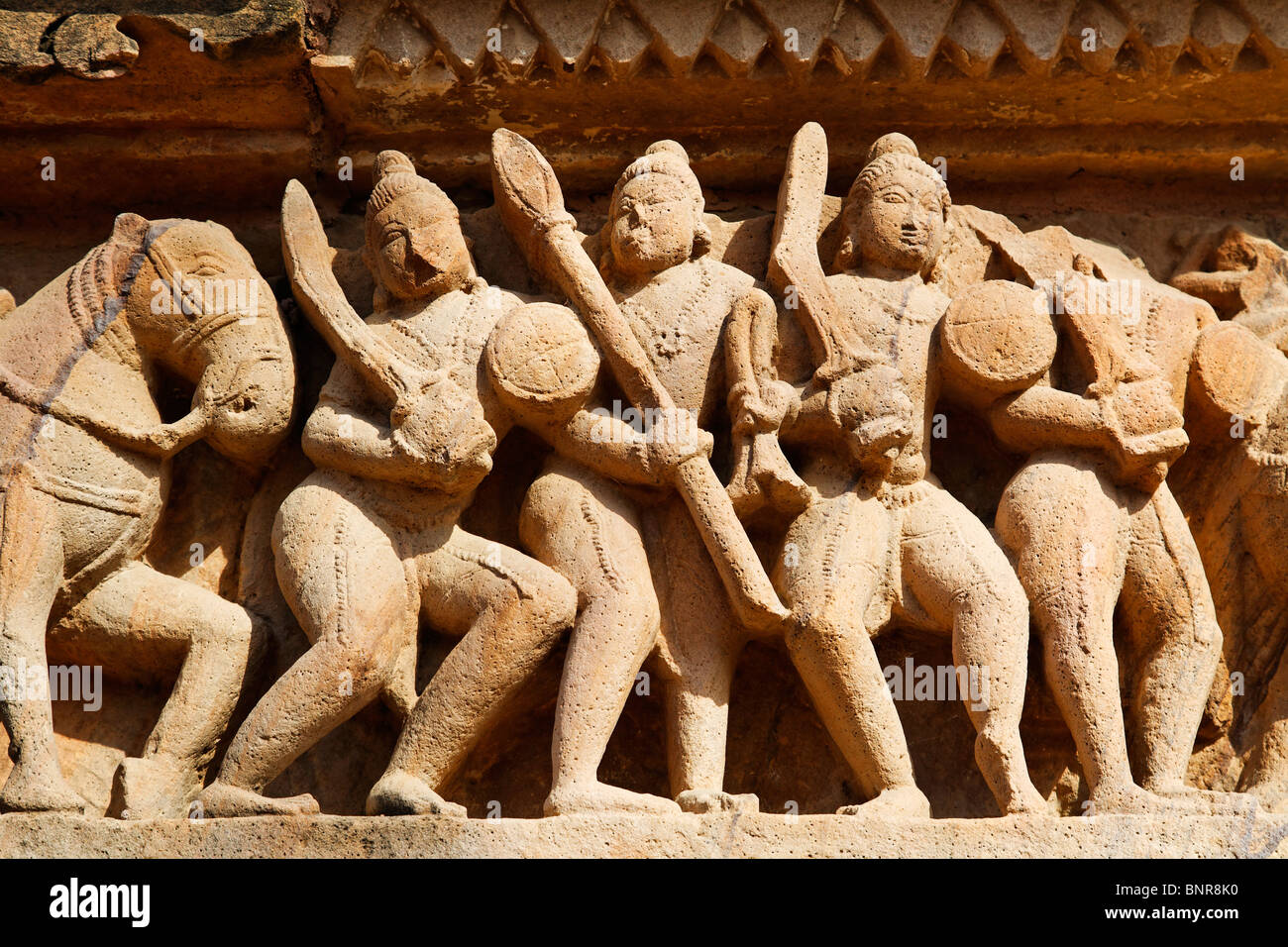 India Madhya Pradesh Khajuraho sculpture of warriors on the Stock