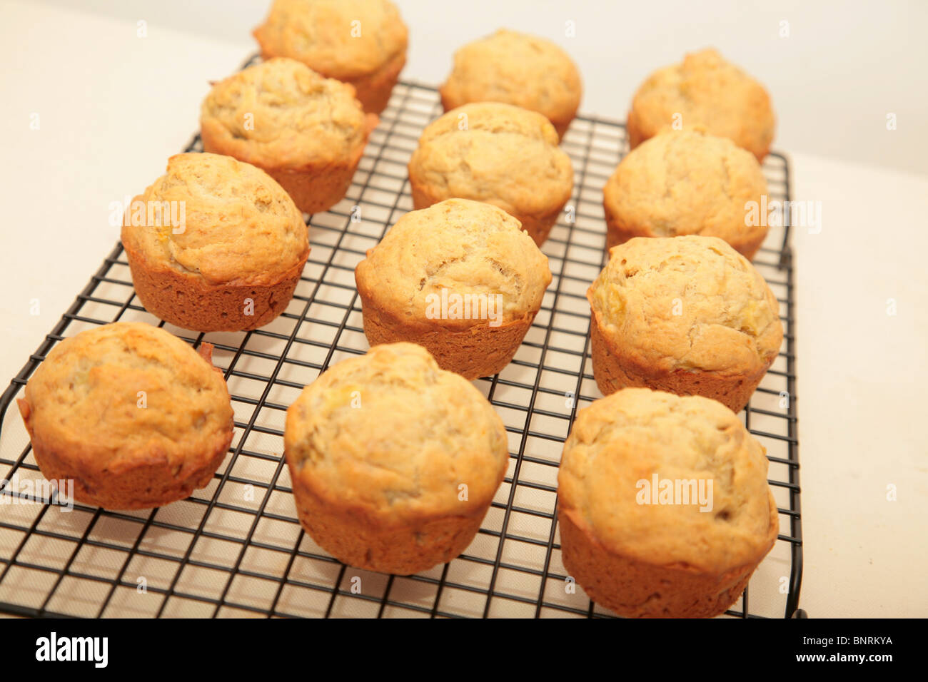 muffins cooling on a baking rack Stock Photo, Royalty Free Image