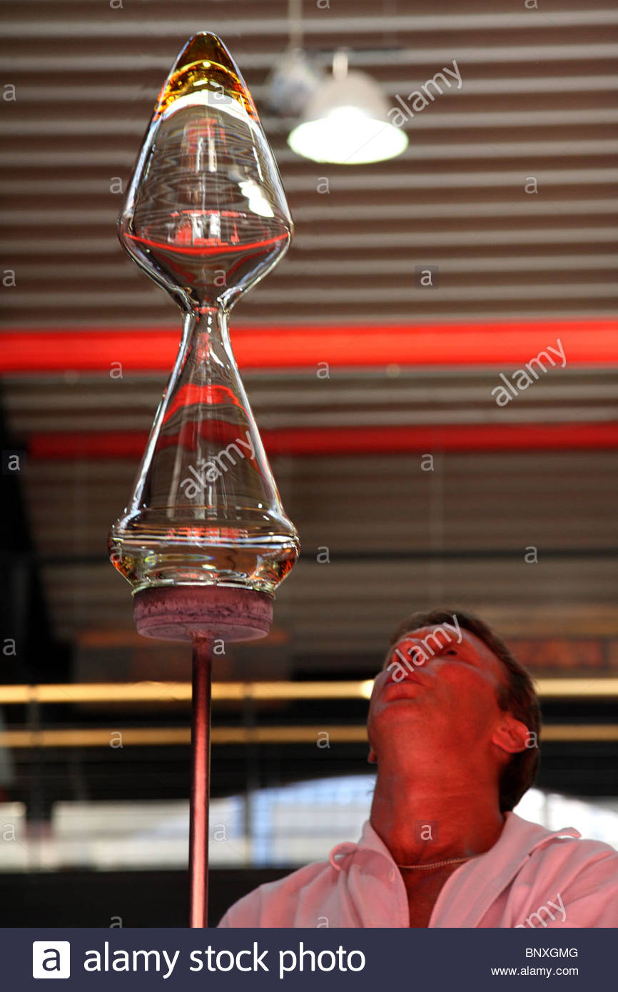 A Glassmaker Working On A Newly Designed Wine Decanter In Riedel Stock