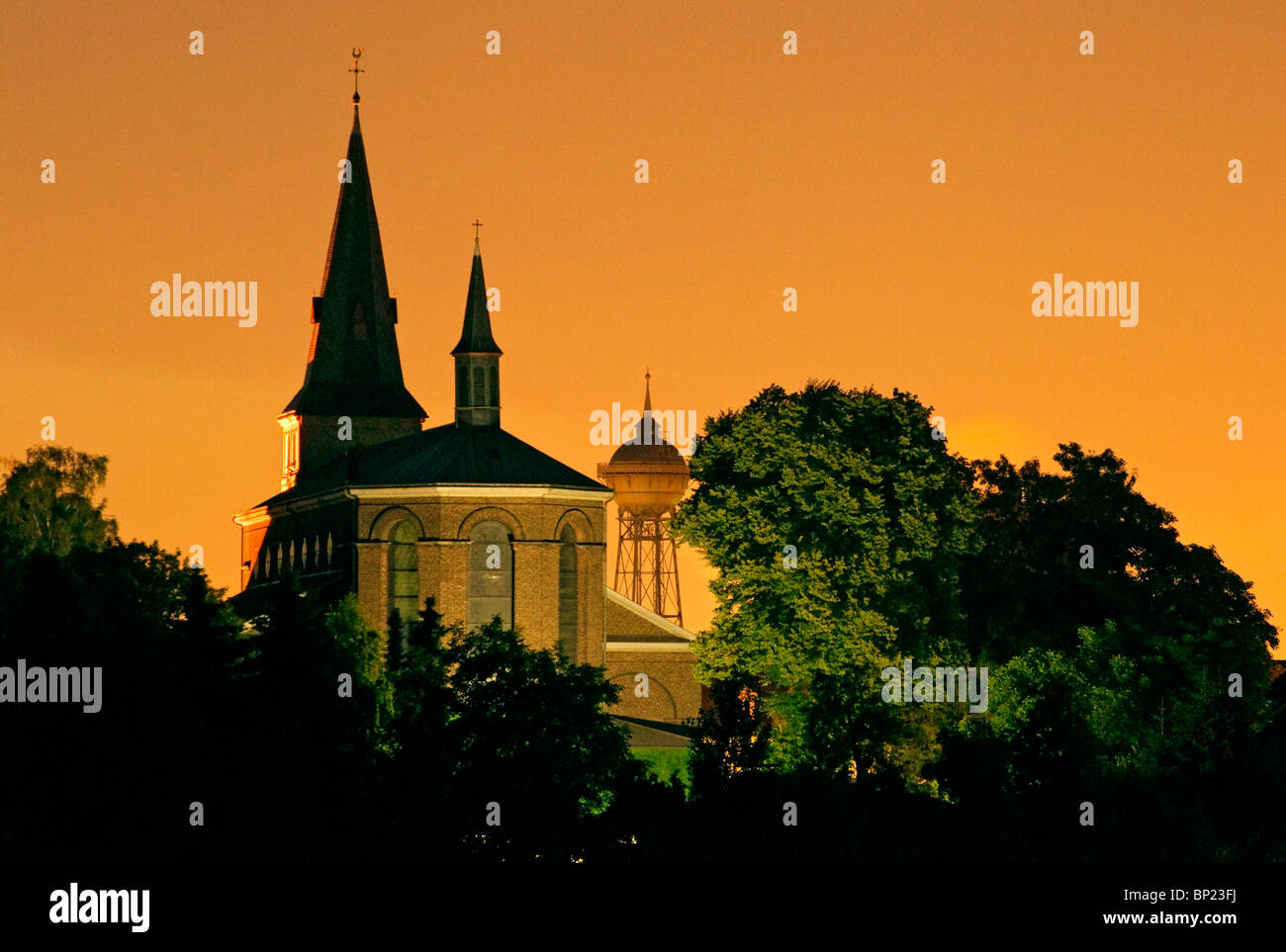 Church__water_tower_at_night_set_against