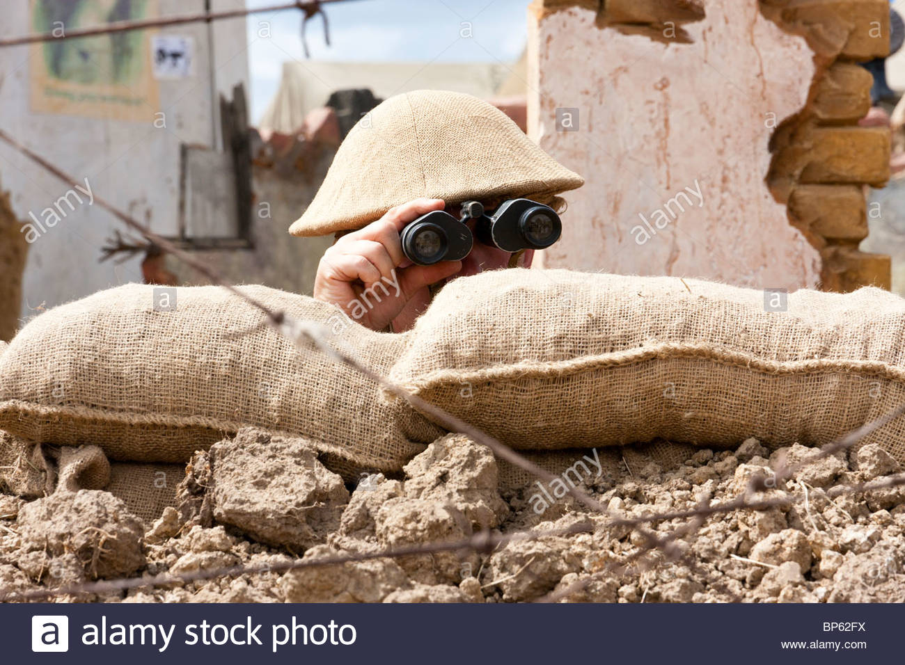 re-enactment-british-office-in-trench-looking-over-the-top-through-BP62FX.jpg