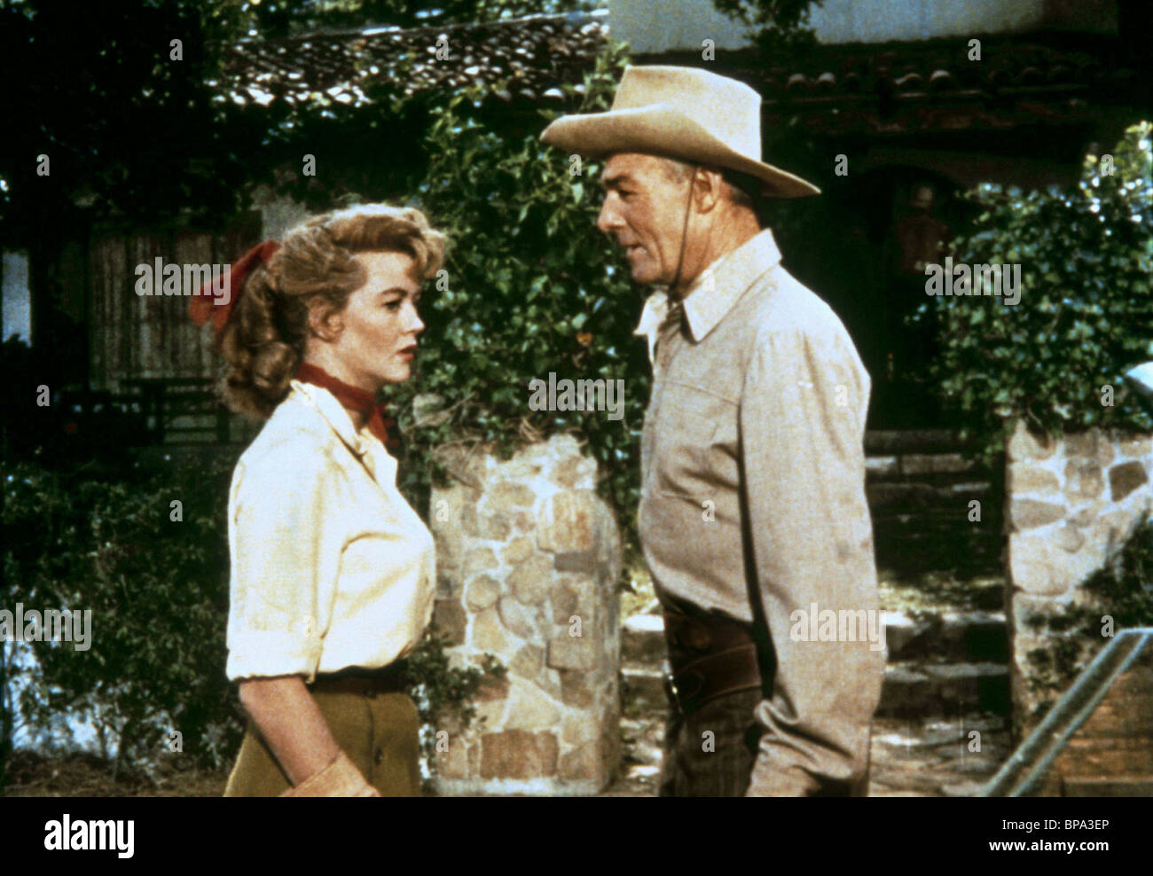 DOROTHY MALONE & RANDOLPH SCOTT TALL MAN RIDING (1955 Stock Photo