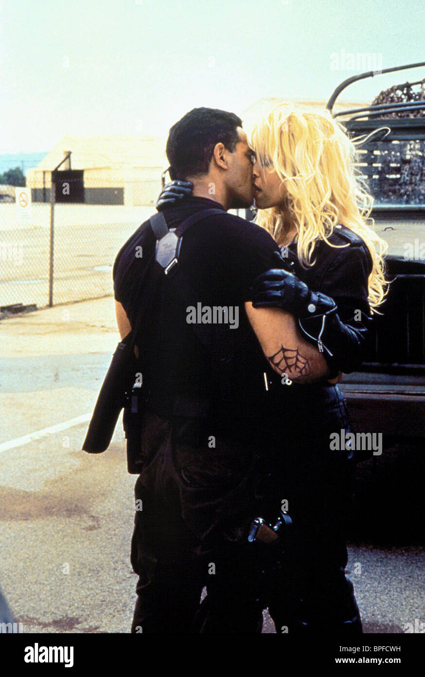 TEMUERA MORRISON & PAMELA ANDERSON BARB WIRE (1996 Stock Photo, Royalty