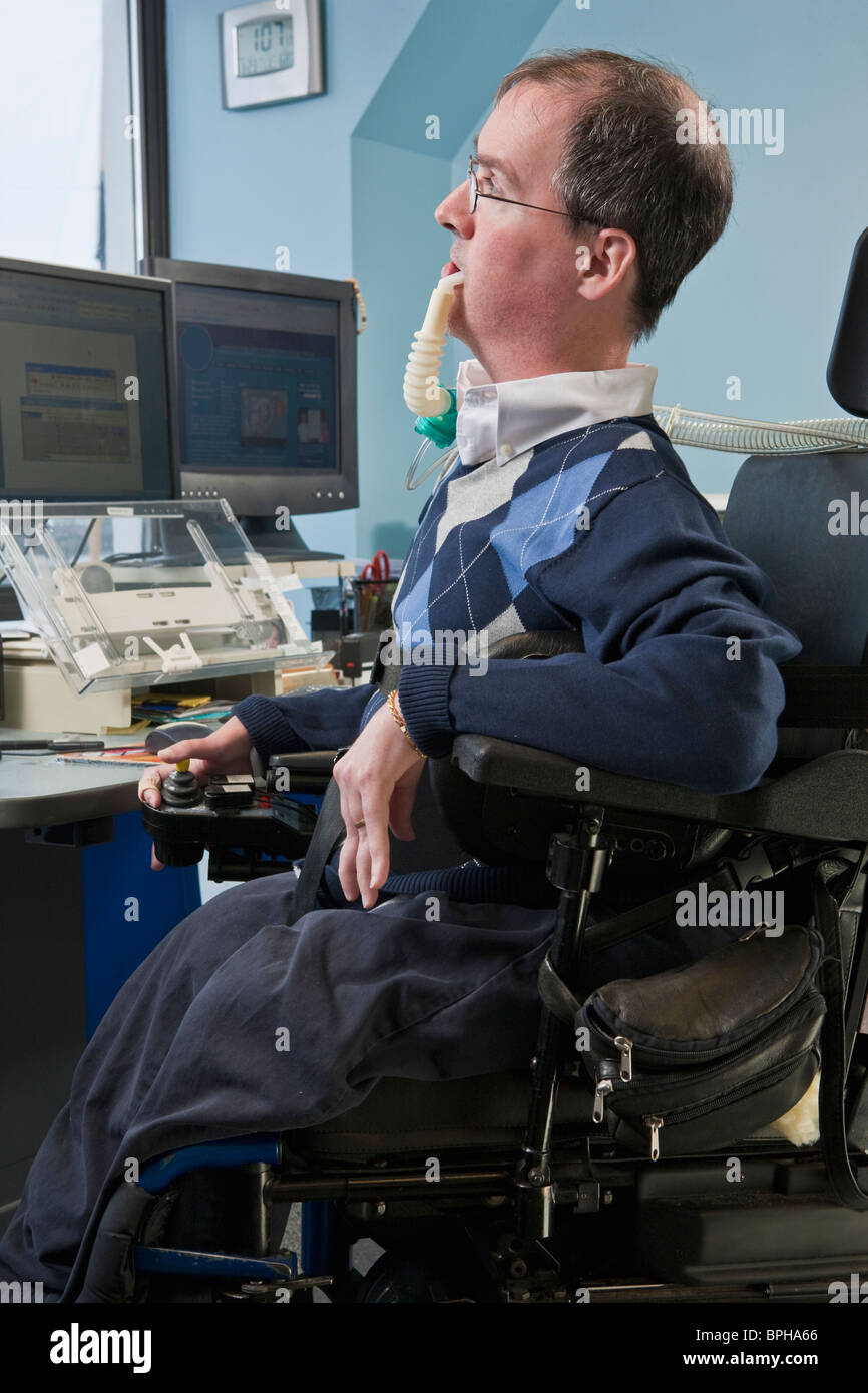 Businessman with Duchenne muscular dystrophy in a motorized Stock Photo