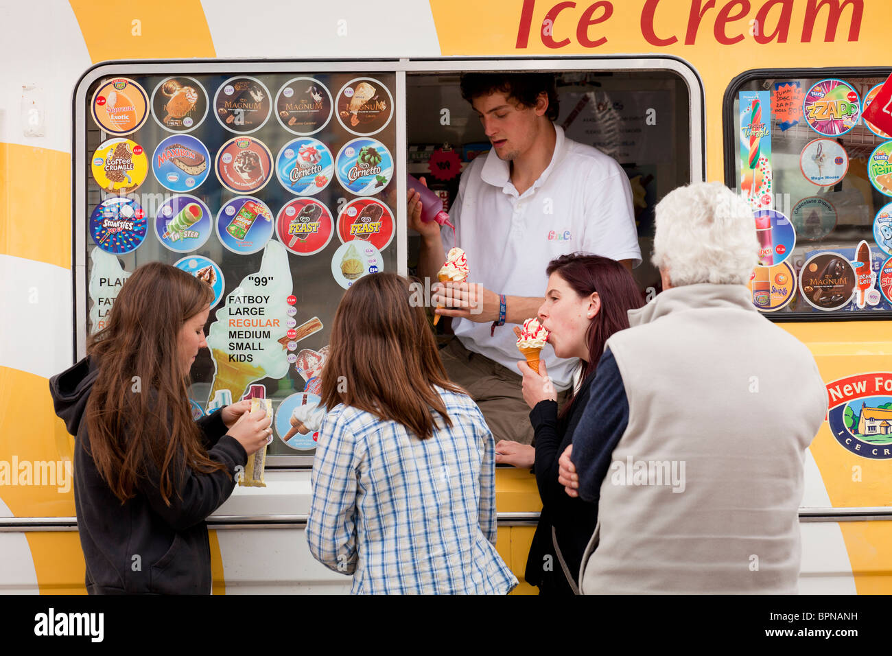People buying ice creams from a van Stock Photo, Royalty Free Image