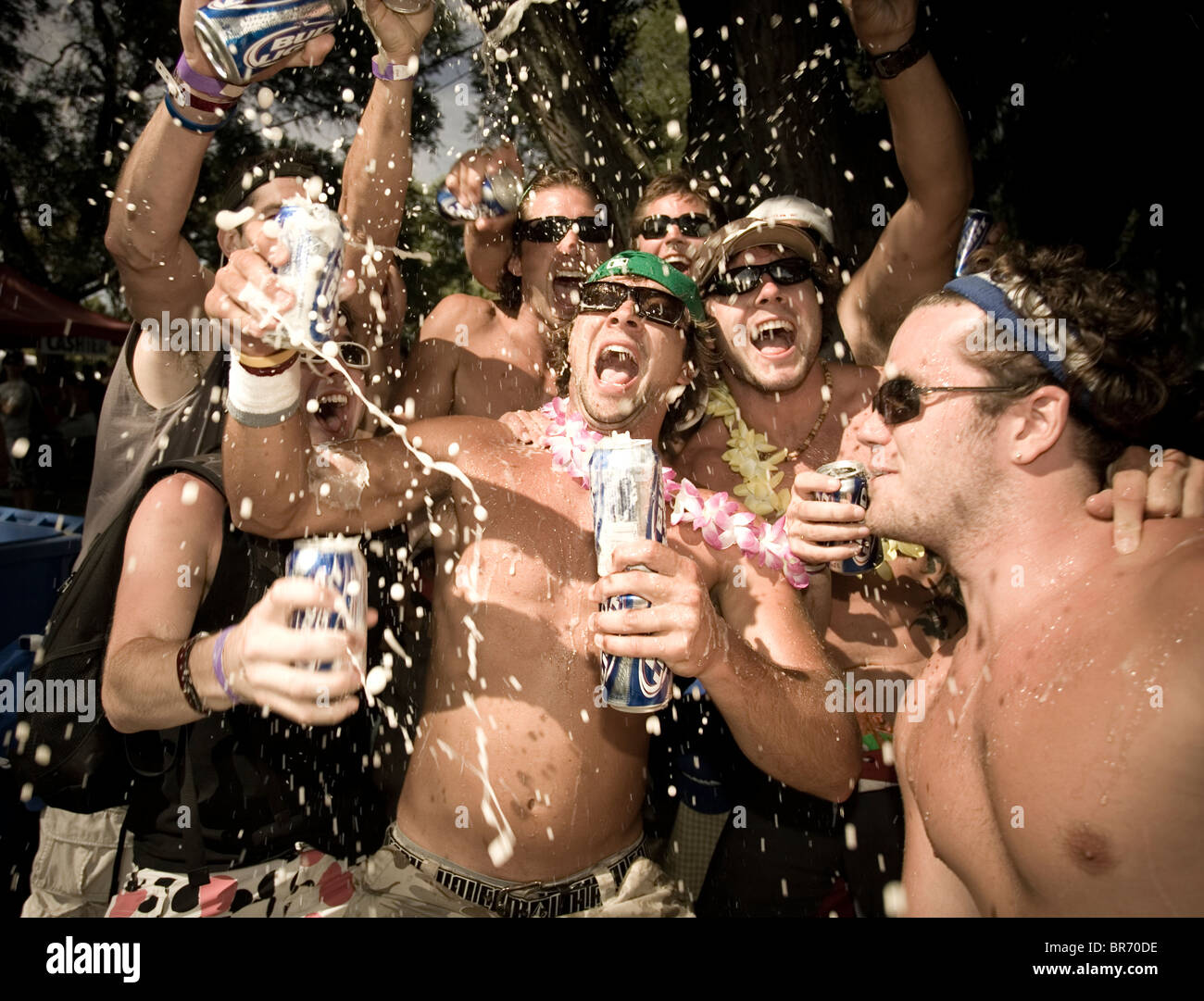 male-adults-spraying-beer-at-a-party-in-toronto-ontario-BR70DE.jpg