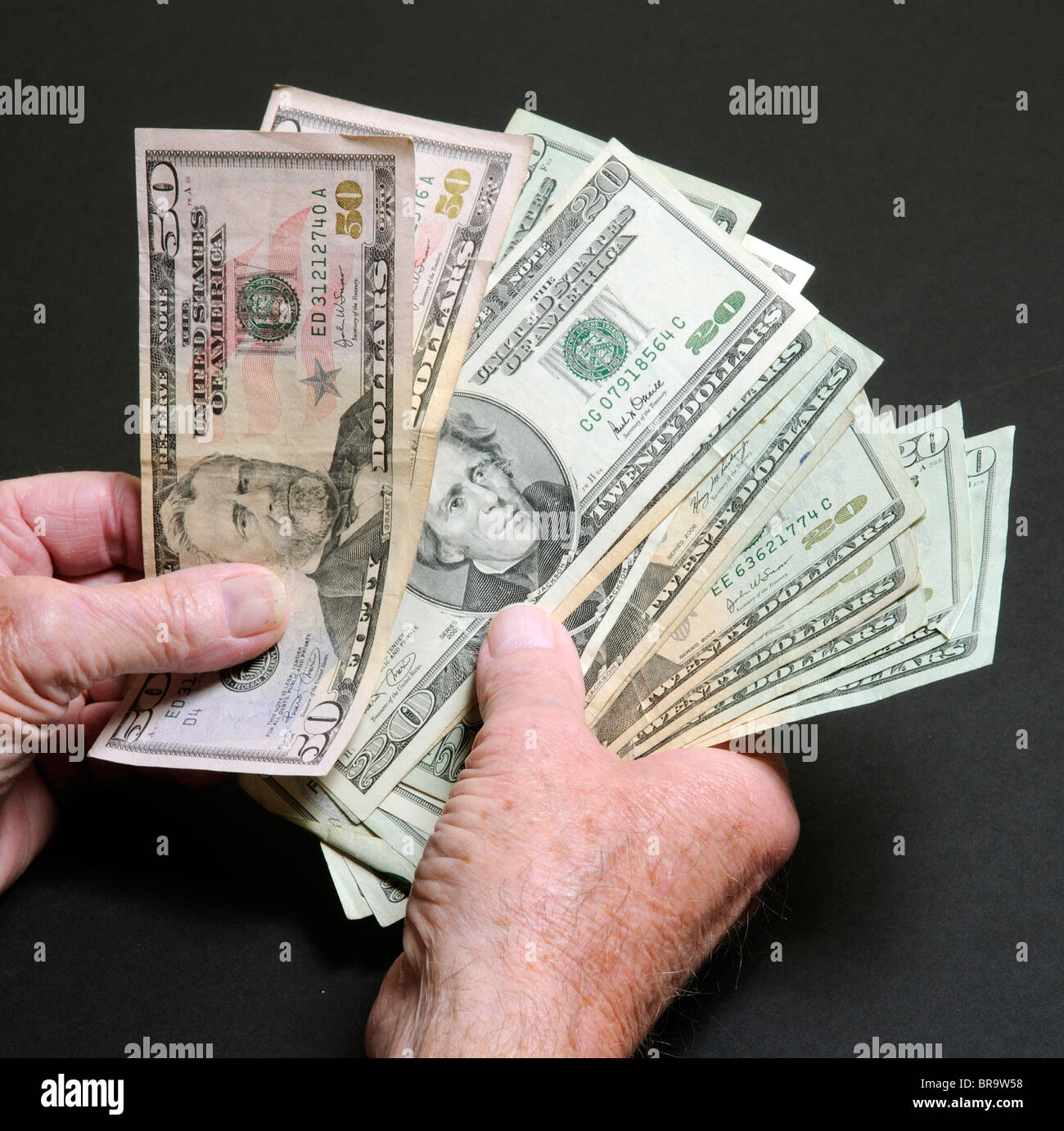 worksheet Counting Dollar Bills handful of us dollars counting 50 and 20 dollar bills stock bills
