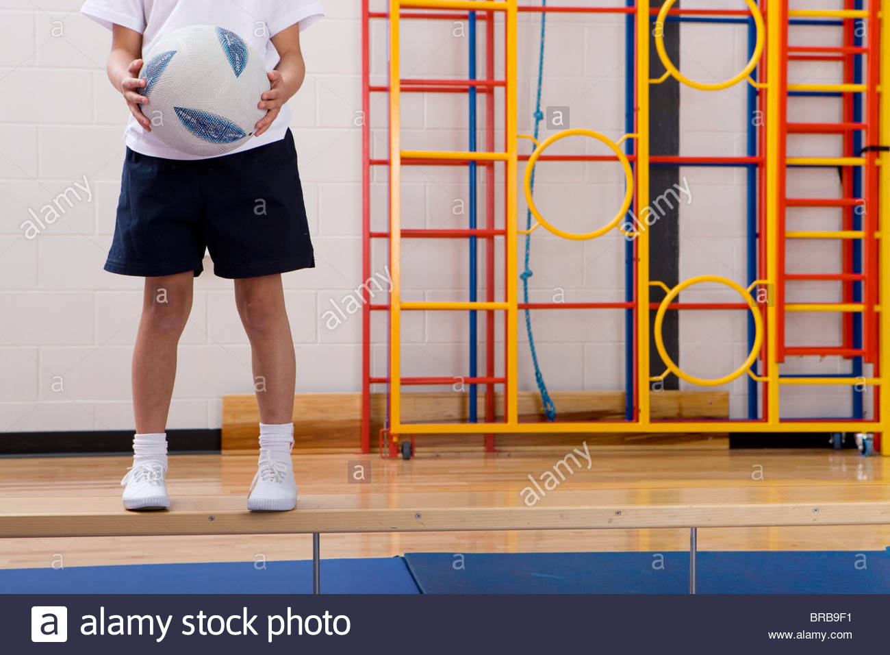 school-boy-standing-on-bench-and-holding