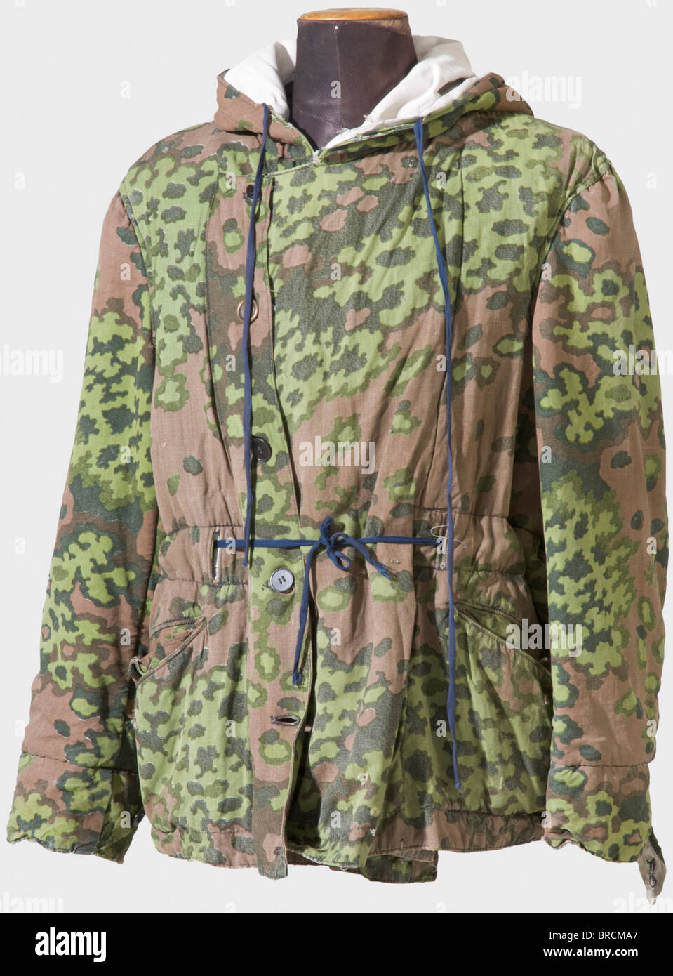 A reversible winter jacket of the Waffen SS, with spring camouflage